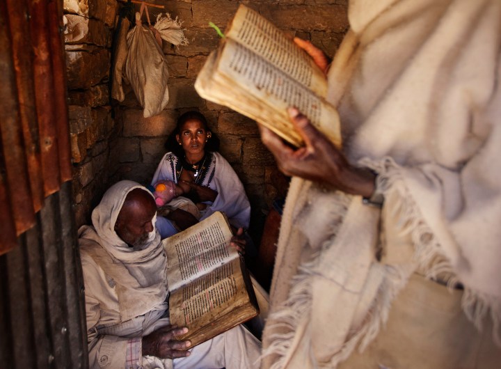 Priests-reading-prayers-during-a-baptism-in-a-small-countryside-church-in-Enderta-area,-Tigray