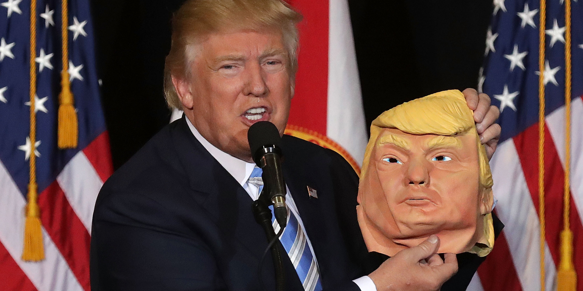 SARASOTA, FL - NOVEMBER 07:  Republican presidential nominee Donald Trump holds up a rubber mask of himself during a campaign rally in the Robarts Arena at the Sarasota Fairgrounds November 7, 2016 in Sarasota, Florida. With less than 24 hours until Election Day in the United States, Trump and his opponent, Democratic presidential nominee Hillary Clinton, are campaigning in key battleground states that each must win to take the White House.  (Photo by Chip Somodevilla/Getty Images)